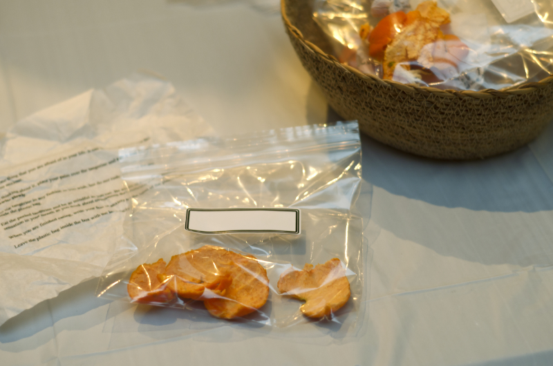 a tangerine peel in a sealed ziplock bag with a blank label